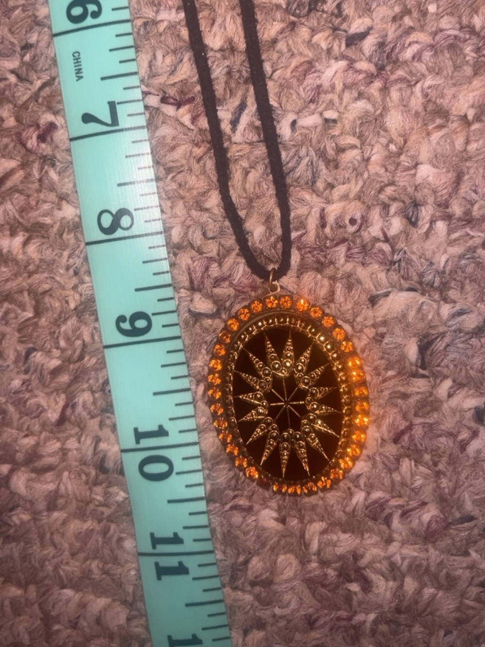 Gold-Tone Sunburst Pendant Necklace with Amber Stones on Black Cord